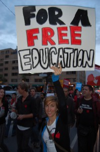 A woman holds a sign reading "Free education" at a student protest in Toronto on June 5, 2012