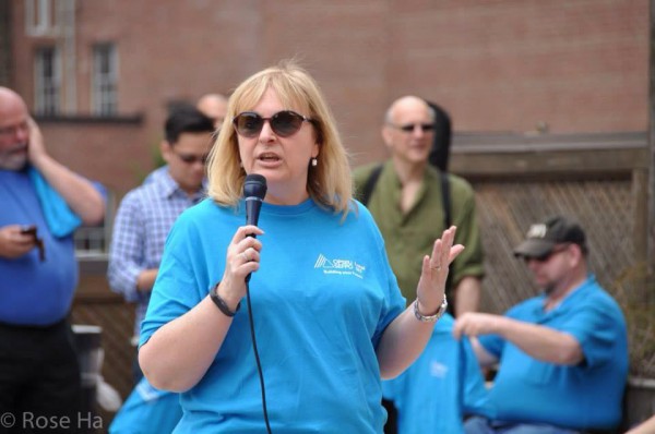 Marilou Martin, president of the support staff union at George Brown College, addresses workers at a union BBQ at St. James campus in the summer. Photo courtesy OPSEU.