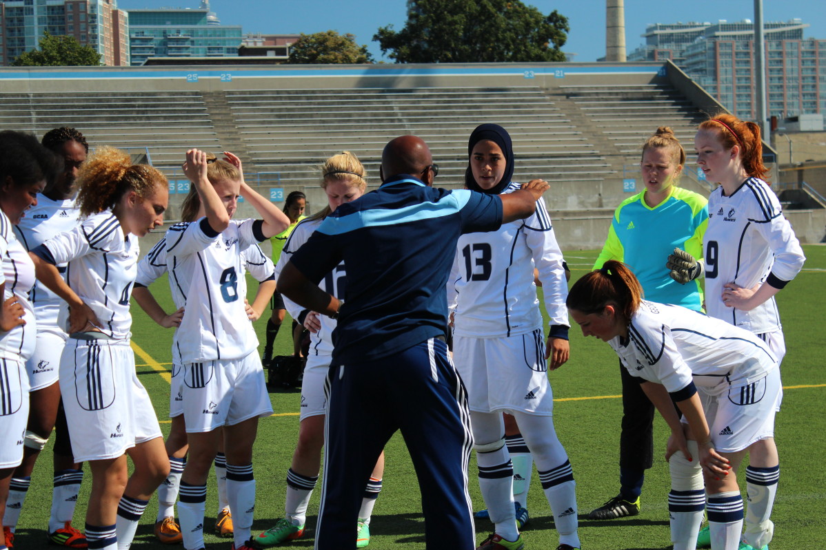 The Huskies women's soccer team ends game with a loss on Saturday against the St. Lawrence college Vikings. Head coach John Williams speaks to team during their "half-time pep talk" Photo: Brittany Barber/The Dialog