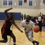 Curtis Baanee, right, of George Brown College dribbles past Adrian Tucker of the Seneca Sting in the Huskies' home opener on Oct. 22. Photo: Brittany Barber/The Dialog