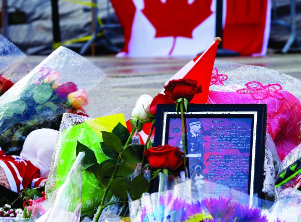 People left flowers and a picture of Cpl. Nathan Cirillo at the national war memorial in Ottawa where he was killed.</br> PHOTO: FLICKR USER JAMIE MCCAFFREY (CC BY 2.0)