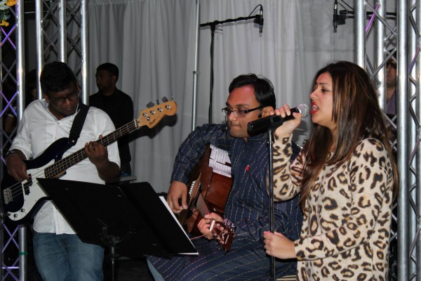 Malcolm Melvin (bass), Hemant Agnani (guitar) and Shivangi Karla (singing) perform with their band Colours at Desi Night in the Kings Lounge on Nov. 21. Photo: Brittany Barber/The Dialog