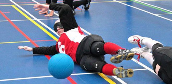 Image of Jillian MacSween at the parapan games playing goalball on the floor