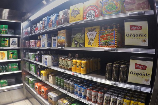 Image of a Shelfs stocked with Beer cans and bottles
