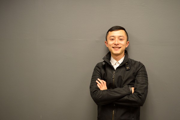 Image of Jerry Gou the winner of International Student Excellence Award for entrepreneurship standing against a grey wall