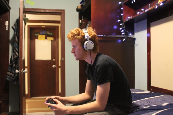 Image of a person gaming with headset on