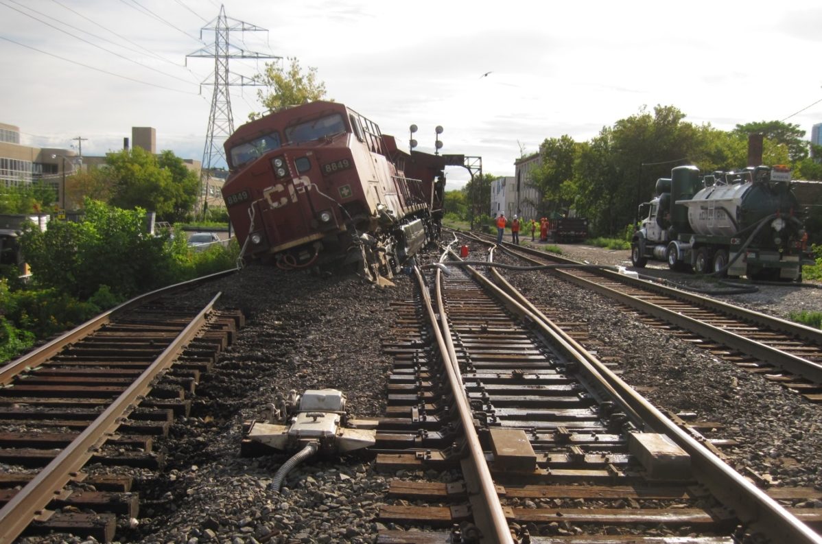 A train derailed on the tracks just south of Casa Loma campus after a collision. Photo: Transportation and Safety Board of Canada