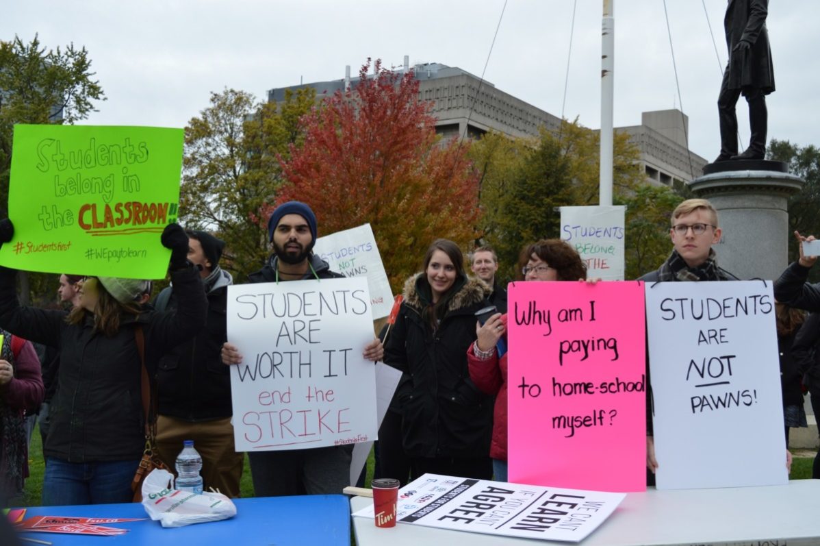 Students rally at Queen's park