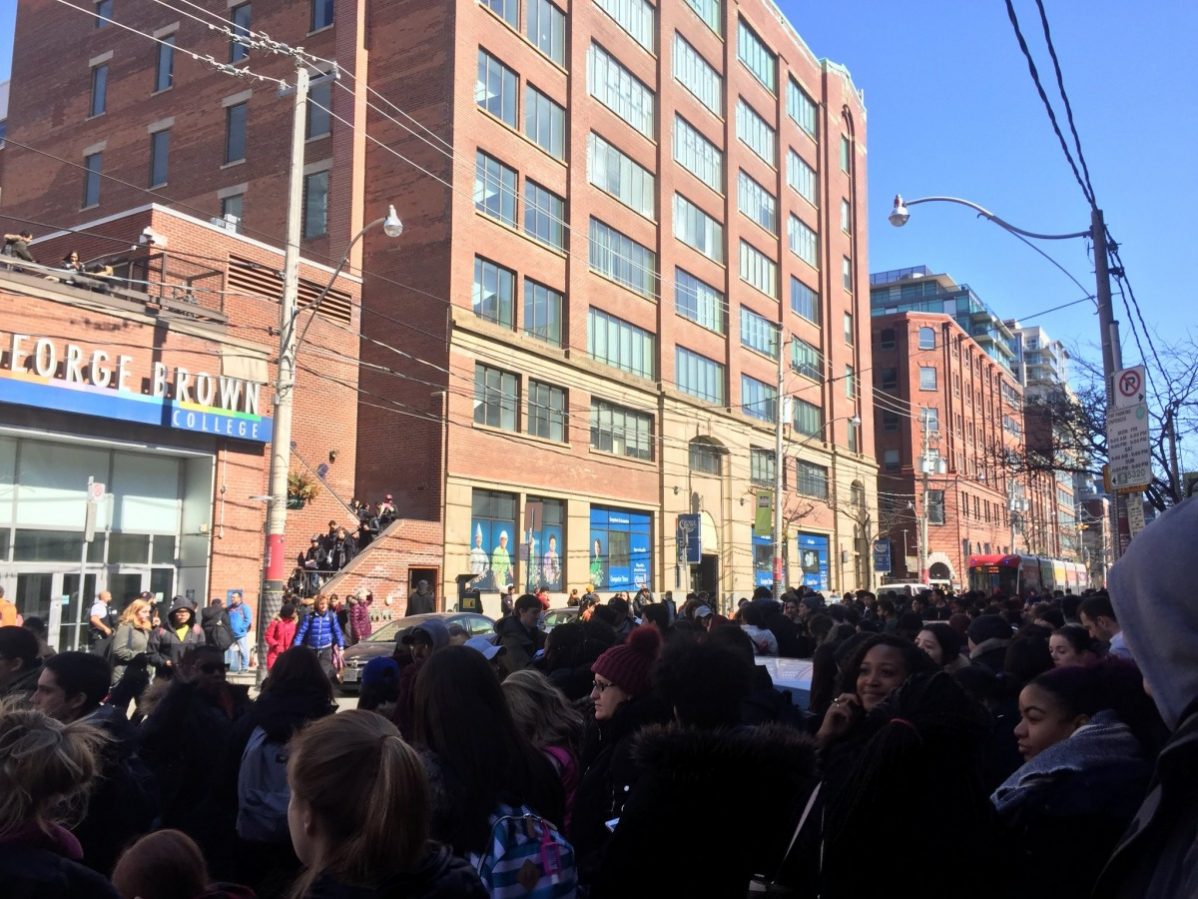 A report of a dangerous package at George Brown College's main St. James campus at 200 King St. East forced hundreds of students outside as police swept the building before declaring it safe. Photo: Natasha Burtenshaw-deVries