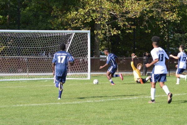 George Brown Huskies forward Shaquille Agard scores