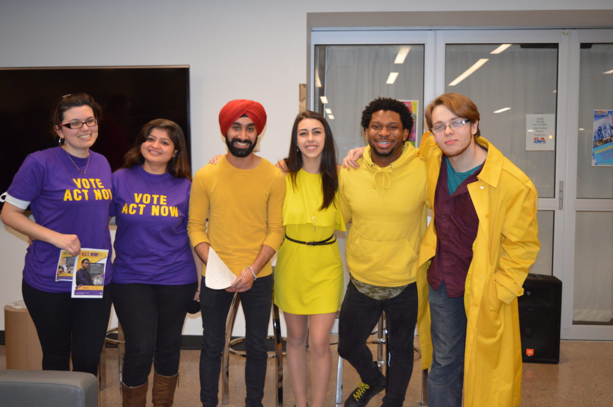 Act Now and V3 candidates pose for a picture at the end of the Casa Loma debates. Photo by Indira Ordaz / The Dialog