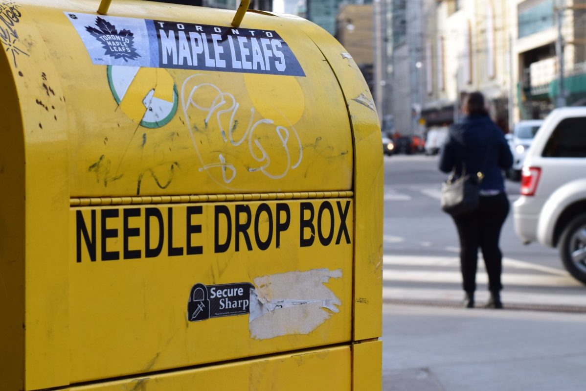 A needle disposal box outside the Works which is a needle exchange program located at 277 Victoria St. Photo: Timo Cheah / The Dialog